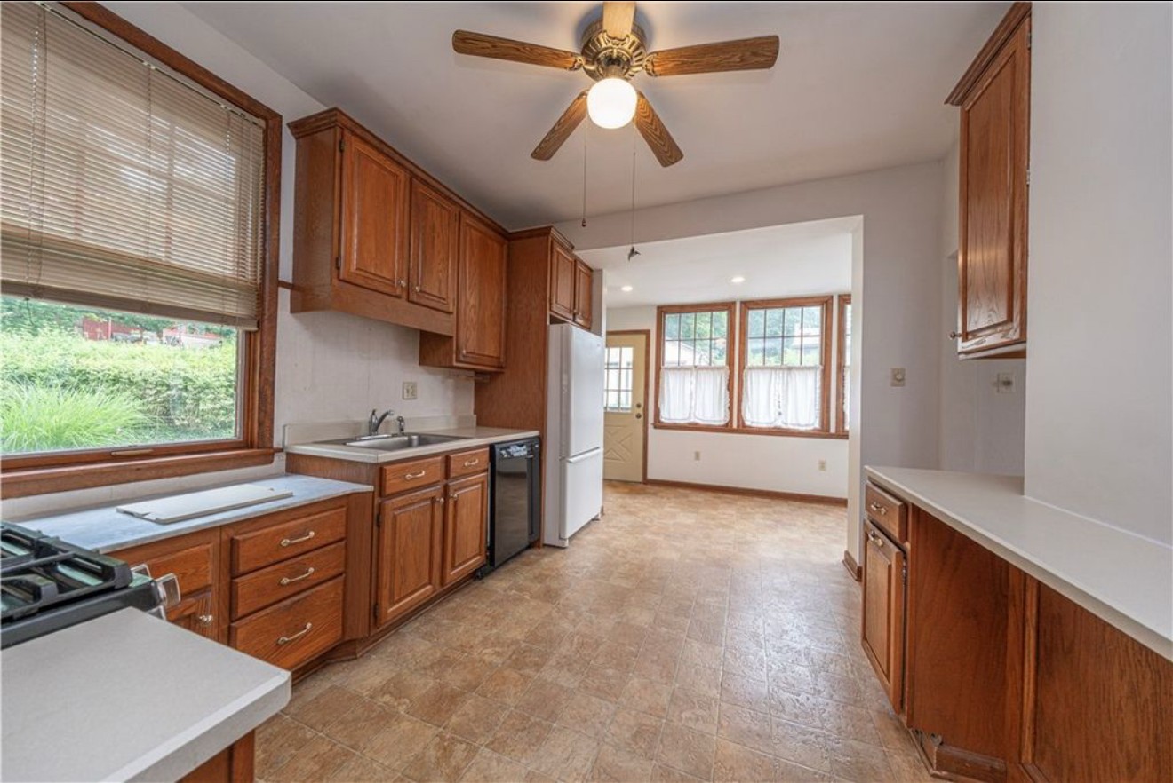 Here is the original kitchen layout. The all white wall on the right is where the brick fireplace was behind the drywall.
